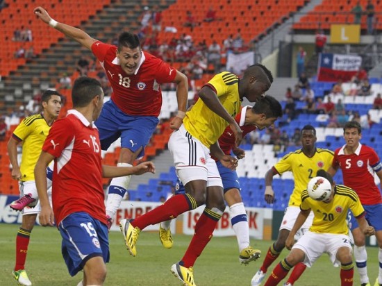 Chile's Castillo heads ball past Colombia's Mauricio Castillo during their South American Under-20 championship soccer match in Mendoza