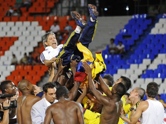 Colombia players celebrate with their coach Restrepo after beating Paraguay to finish among the top four during the final day of the South American Under-20 soccer championship in Mendoza