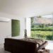 Bedroom in modern house overlooking rural landscape