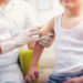 Pediatrician makes vaccination to small boy