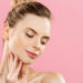 Beauty skin Concept - Beautiful Young Caucasian Woman with Clean Fresh Skin look away with pink studio background. Girl beauty face care. Facial treatment. Cosmetology , beauty and spa.