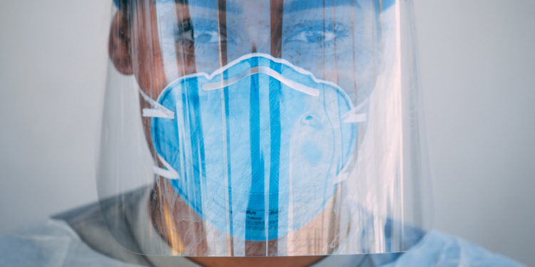 Airman 1st Class Rachel Tucker, 56th Medical Group medical technician, poses for a portrait March 23, 2020, at Luke Air Force Base, Ariz. In an effort to contain the coronavirus pandemic, the 56th MDG worked over the weekend to facilitate screenings. The 56th MDG is following the Centers for Disease Control and Prevention guidelines and working closely with Arizona health officials to decrease the impact of COVID-19 at Luke AFB. (U.S. Air Force photo by Senior Airman Alexander Cook)