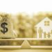 Legacy / inheritance or death tax concept : US dollar bag, a house and family members e.g father, mother, son, daughter on a balance scale, depicts a tax paid by person who inherits money or property.