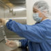 Michelle Mendoza, pharmacy technician, reconstitutes the remdesivir research drug under an intravenous hood at Brooke Army Medical Center, Fort Sam Houston, Texas, April 29, 2020. BAMC is participating in a COVID-19 treatment trial centering on the anti-viral drug, remdesivir. The National Institute of Allergy and Infectious Diseases (NIAID)-sponsored study has enrolled hundreds of people across the nation as it looks to determine if the antiviral drug is effective against COVID-19. (U.S. Army photo by Jason W. Edwards)