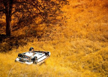 Rollover Compact Car Crash. White Crashed Car in the Mountain Road Ditch in California, USA. Traffic Accident.