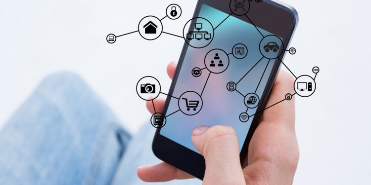 digital composite of hand holding smartphone with vignettes