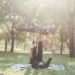 Sportive couple doing yoga outdoor park - Personal trainer and sportive woman training outdoor