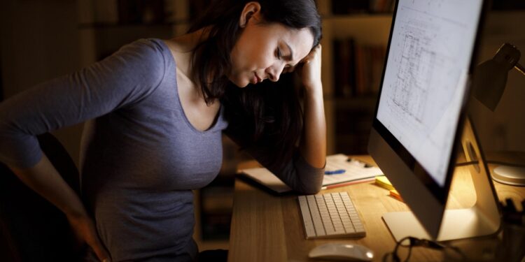 Woman suffering from backache