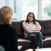 Shot of a young woman having a therapeutic session with a psychologist