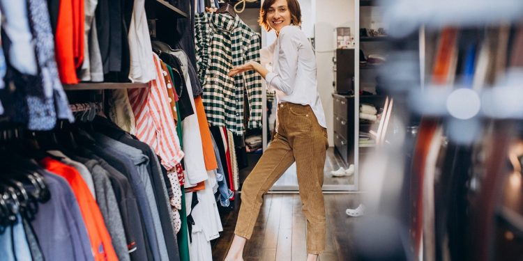 Woman at home choosing cloth from her check-room
