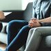 Counseling and therapy for couple and family. Adoption, psychology or psychotherapy concept. Session with psychiatrist or psychologist. Husband and wife with marriage counselor. Man, woman and doctor.