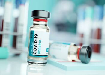 A vial of SARS-CoV2 COVID-19 vaccine in a medical research and development laboratory. Science 3D illustration.