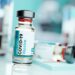 A vial of SARS-CoV2 COVID-19 vaccine in a medical research and development laboratory. Science 3D illustration.