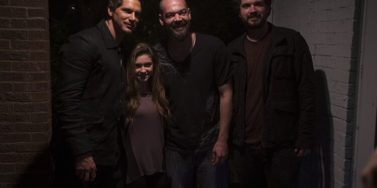 Zak, Aaron, and Jay pose with pyschic Anissa in front of the Sallie House.