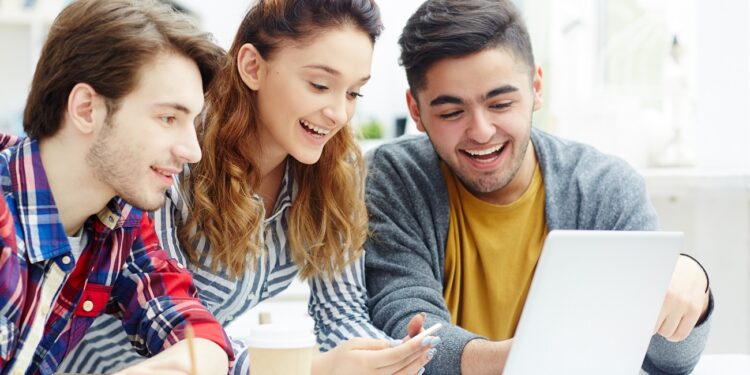 Happy learners video chatting with friends online