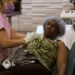 Dr. Sandra Lee injects Brittney to numb the area before surgery.