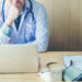Doctor is working in office sitting, thinking about Disease problem of patient