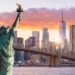 Statue Liberty and  New York city skyline at sunset,  in United States