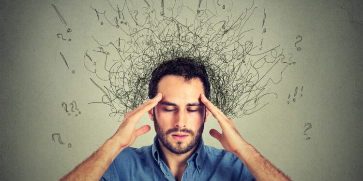 Closeup sad young man with worried stressed face expression and brain melting into lines question marks. Obsessive compulsive, adhd, anxiety disorders