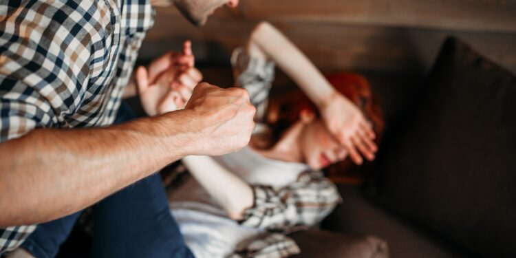 Angry husband beats his wife, domestic violence, quarrel, agressive couple fight. Man and woman in conflict. Problem relationship