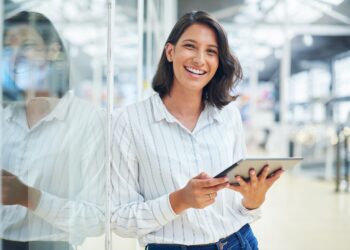 Shot of a young businesswoman using a digital tablet in a modern office