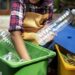 Closeup of hands separating plastic bottles
