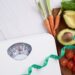 Weight loss scale with centimeter. Diet concept. Healthy food background. Food photography different fruits and vegetables. concept slimming diet fresh vegetables. top view.