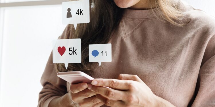 Woman using a smartphone social media conecpt