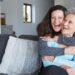 Portrait of happy mid adult woman embracing her senior mother. Mother and daughter at home, family scene. Family relationships concept