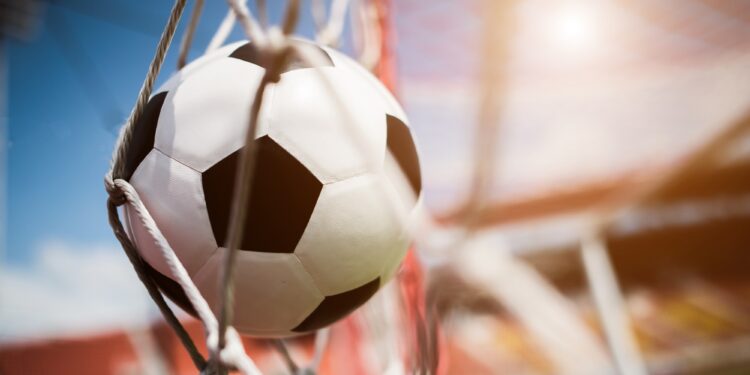 Soccer into goal success concept