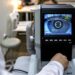 optometrist examining female patient in ophthalmology clinic
