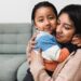 Happy Latin American mother and son hugging each other at home - Family love concept - Focus on child face
