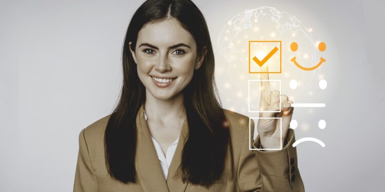 Young business woman checking on satisfaction checklist box.Copy space.