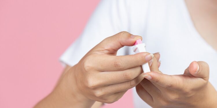 World diabetes day; close up picture of using medical device for check glucose in the blood.