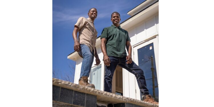 Hosts Chris & Calvin LaMont posing for a photo in front of a swimming pool install in Dallas, Texas, as seen on Buy It or Build It.