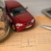 Car and calculator with coins on bookbank background, Car loan, Finance, saving money, insurance and leasing time concepts. coins, Car loan, Finance, saving money, insurance and leasing time concepts.