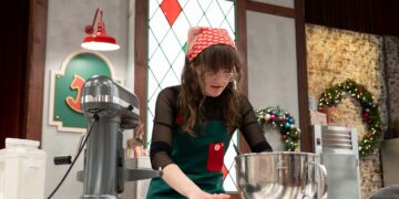 Contestant Emily rolls cookie dough, as seen on Christmas Cookie Challenge, Season 4.