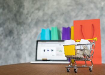 laptop and shopping bags, online shopping concept.