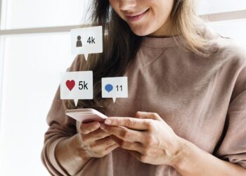 Woman using a smartphone social media conecpt