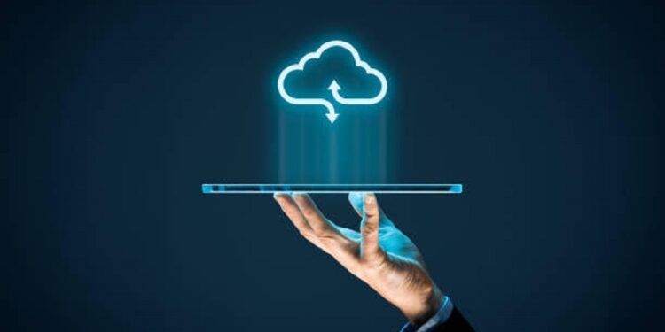 Cloud computing concept - connect devices to cloud. Businessman or information technologist with cloud computing icon and tablet.