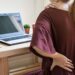 Young woman working at home and having back pain,  Healthcare and problem concept office syndrome