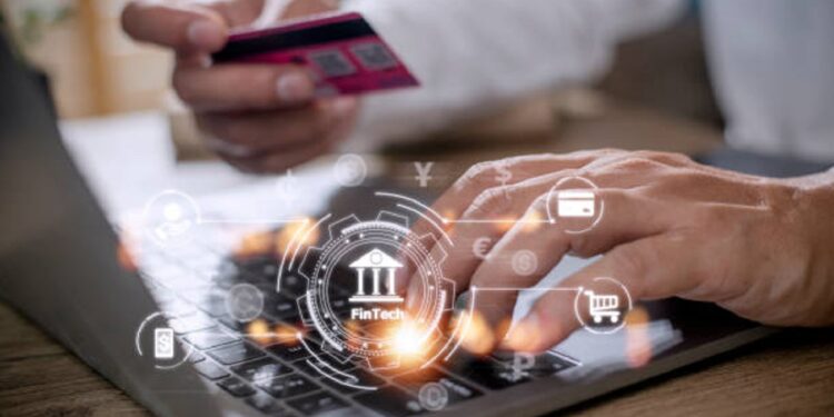 Future of financial technology concept businessman selecting fintech word
