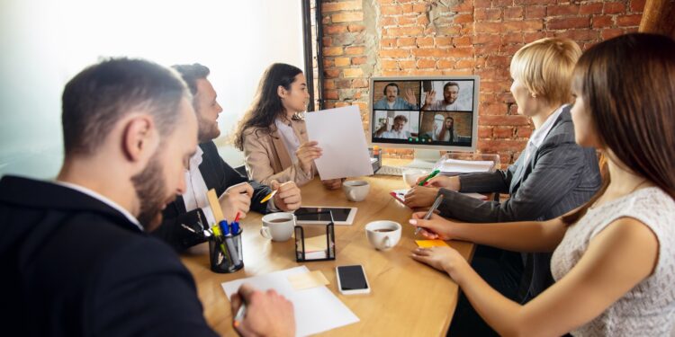 Leader. Young people talking, working in videoconference with colleagues, co-workers at office or living room. Online business, education during insulation, quarantine. Work, finance, tech concept.