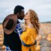 A young interracial couple kisses in a pumpkin field, close-up.; Shutterstock ID 1626962086; purchase_order: 09262022; job: Editorial Associate; client: Ellie Spencer-Failes; other: