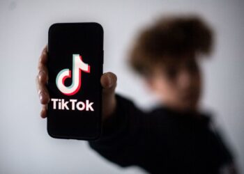 A teenager presents a smartphone with the logo of Chinese social network Tik Tok, on January 21, 2021 in Nantes, western France. (Photo by LOIC VENANCE / AFP) (Photo by LOIC VENANCE/AFP via Getty Images)