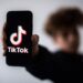 A teenager presents a smartphone with the logo of Chinese social network Tik Tok, on January 21, 2021 in Nantes, western France. (Photo by LOIC VENANCE / AFP) (Photo by LOIC VENANCE/AFP via Getty Images)