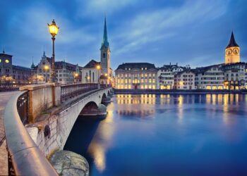 view on Fraumunster Church and Church of St. Peter at night, Zurich, Switzerland
