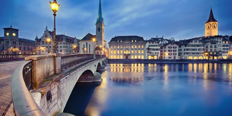 view on Fraumunster Church and Church of St. Peter at night, Zurich, Switzerland