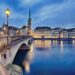 view on Fraumunster Church and Church of St. Peter at night, Zurich, Switzerland