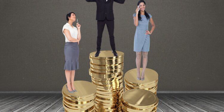 Digital composite image of businesspeople standing on stacked coins against grey background
